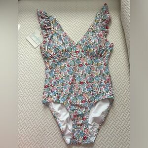 NWT women’s size small floral one piece swimsuit.
